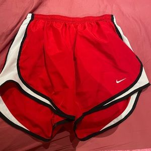 Red Nike dri-fit athletic shorts